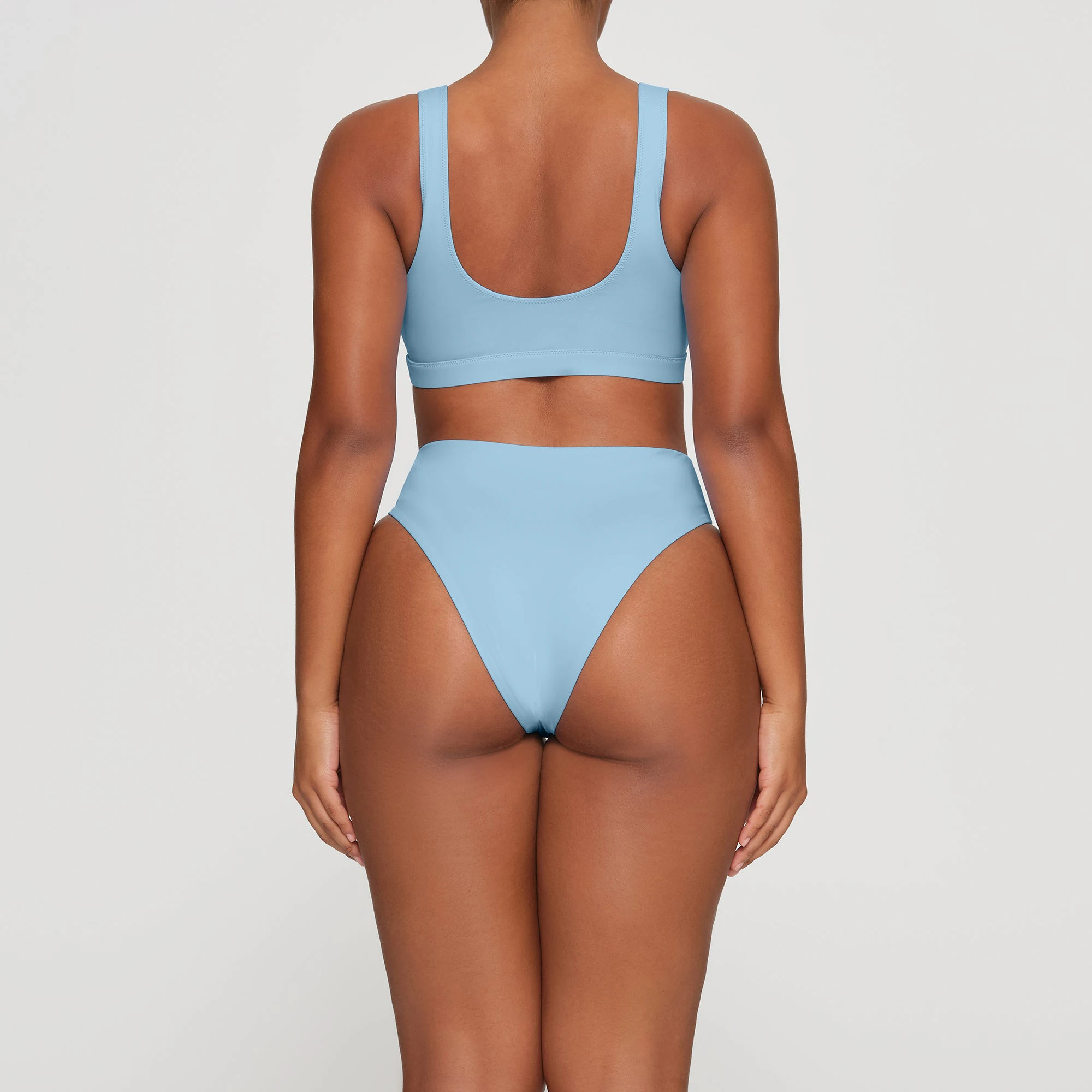 SWIM TANK BIKINI TOP WORN BY A MODEL IN BACK VIEW