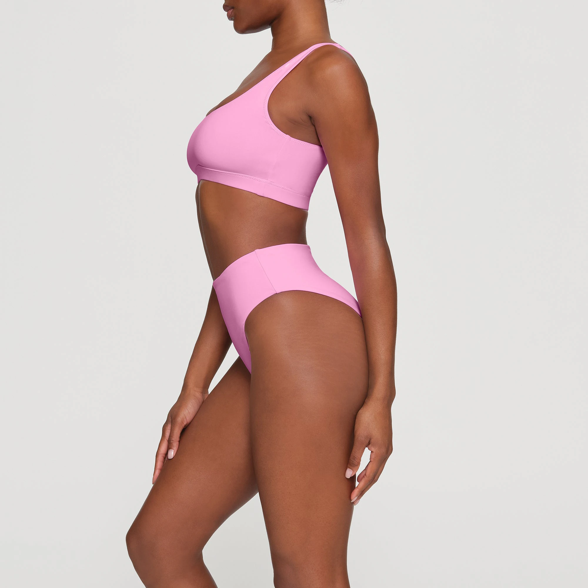 SWIM TANK BIKINI TOP WORN BY A MODEL IN SIDE VIEW