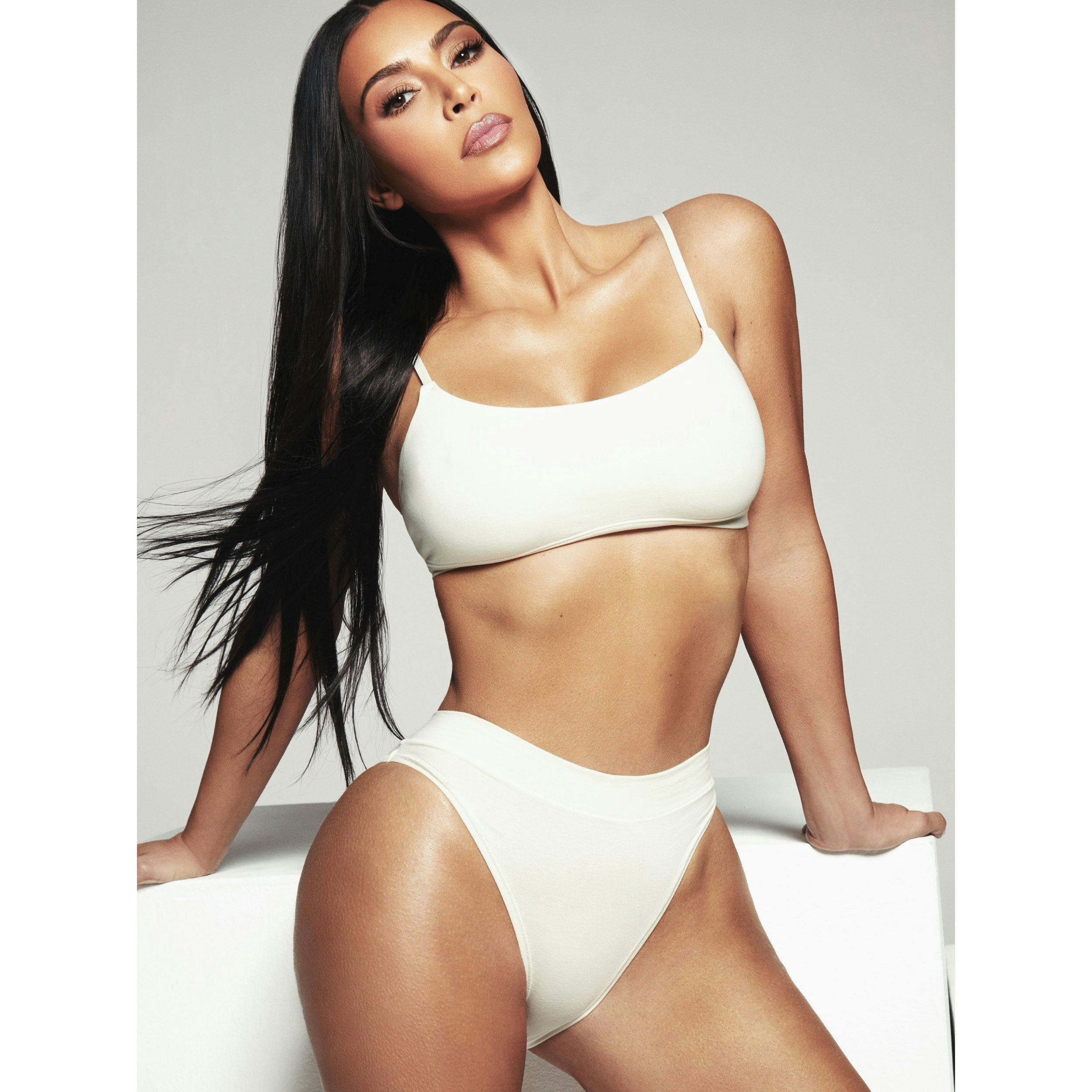 COTTON JERSEY CHEEKY TANGA IS SHOWN ON A MODEL POSING IN STYLISTIC CAMPAIGN IMAGERY