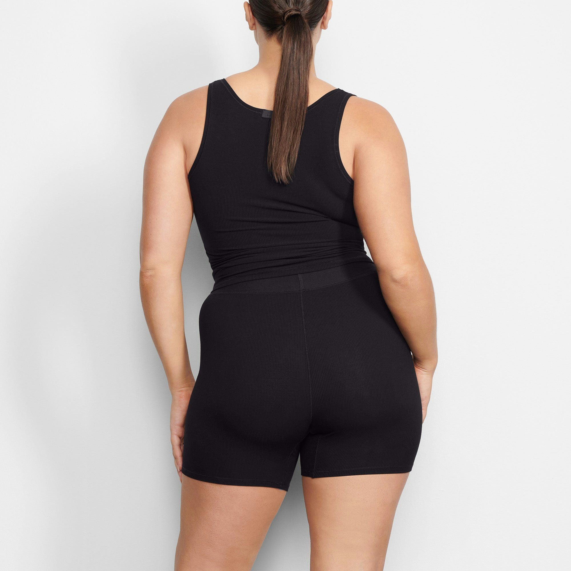 WORN BY A MODEL IN BACK VIEW SOFT LOUNGE BOXER IN ONYX