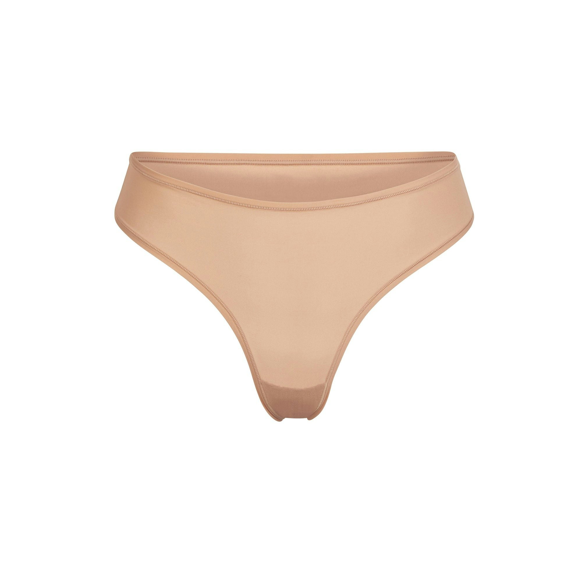 FITS EVERYBODY THONG | OCHRE (THONGS, PANTIES) LAYS FLAT ON A WHITE BACKGROUND | FLT